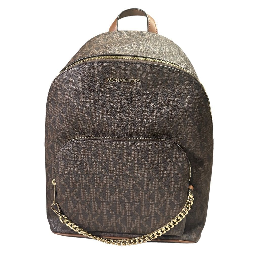 Michael Kors Mono-gram Canvas Jet Set
Backpack. Care tag included